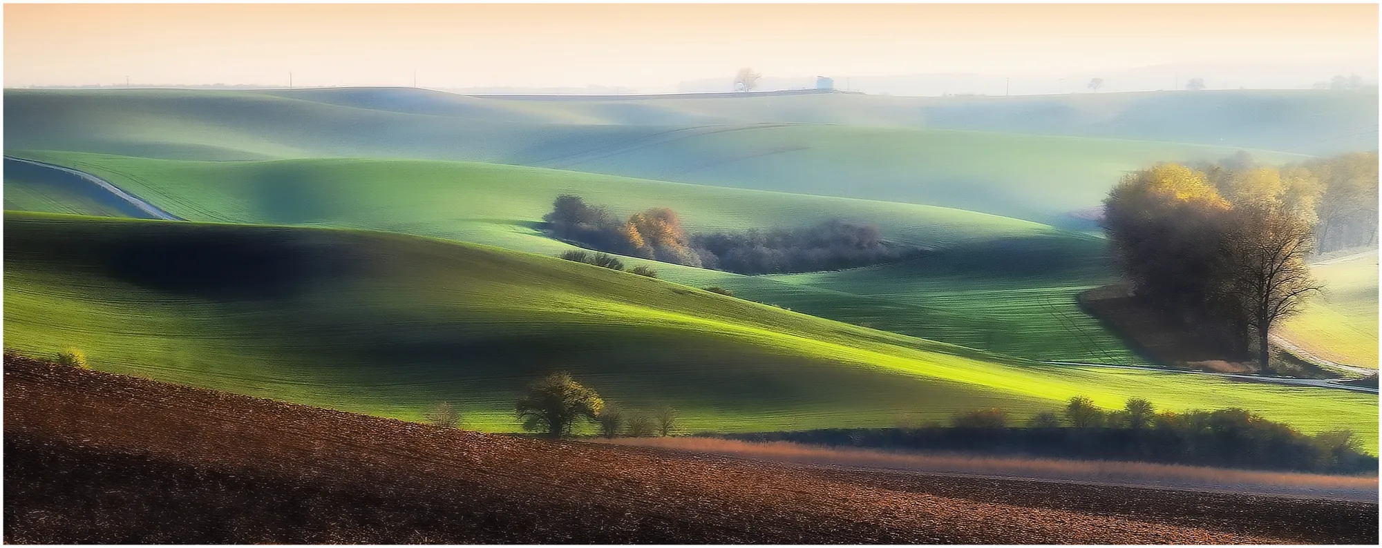 Moravian Tuscany rolling landscape and hills misty photo by Ludek Kliz